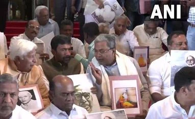 BJP set to unveil Savarkar's photo at K'taka Assembly hall, Cong protests LoP Siddaramaiah and other Congress MLAs protest outside the Assembly against the installation of a portrait of VD Savarkar in the Assembly hall