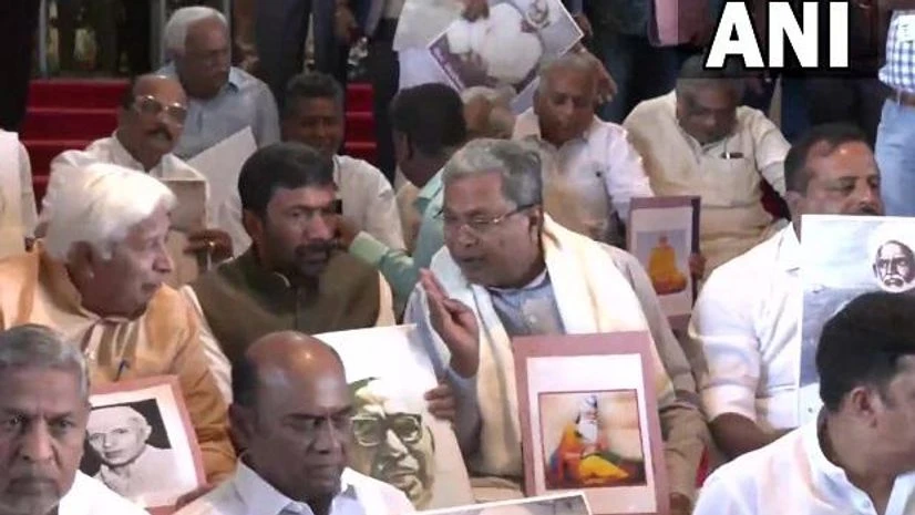 LoP Siddaramaiah and other Congress MLAs protest outside the Assembly against the installation of a portrait of VD Savarkar in the Assembly hall LoP Siddaramaiah and other Congress MLAs protest outside the Assembly against the installation of a portrait of VD Savarkar in the Assembly hall