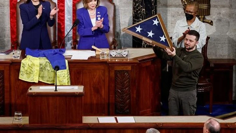 Zelenskyy Ukraine's President Volodymyr Zelenskiy receives a US flag during a joint meeting of the US Congress in the House Chamber of the US Capitol in Washington, US, December 21, 2022. (Photo: Reuters)