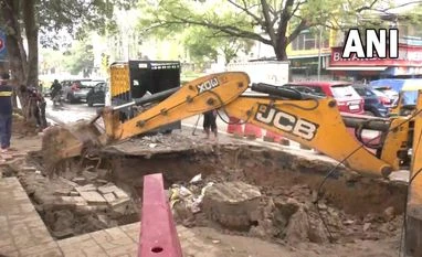 Traffic police issues advisory after road caves in near Delhi's Hauz Rani Repair work is underway at a portion of a road that caved in near Hauz Rani Red Light on Press Enclave Road