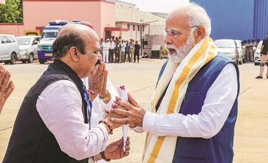 Fraught transition: BJP decided to replace 23 MLAs in Karnataka elections Basavaraj Bommai (left) with Prime Minister Narendra Modi