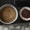 Pokkali rice, right, and Pokkali paddy, from previous harvest, sit at the house of Joseph in Chathamma, Kochi, Kerala