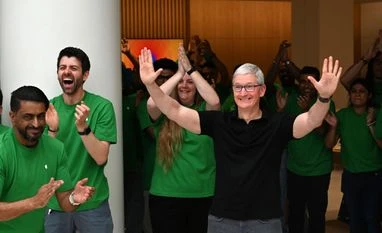 Tim Cook sees India at 'tipping point' for Apple as China pivot quickens Tim Cook greets customers during the opening of the new Apple Saket store in New Delhi