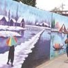 An artist works on a wall mural in Srinagar as city gets ready to welcome G20 delegates. Photo: Firdous Hassan