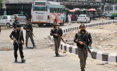 G20 in Kashmir kicks off amidst security, delegates given rousing welcome Srinagar: Crisis Response Team (CRT) personnel patrol at a bus stand amid high alert for the G20 meetings, in Srinagar