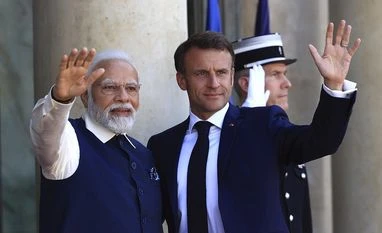 PM Modi arrives at Louvre museum in Paris for banquet dinner with Macron Indian Prime Minister Narendra Modi and French President Emmanuel Macron wave before their talks at the Elysee Palace in Paris, Friday, July 14, 2023. Photo: AP/PTI