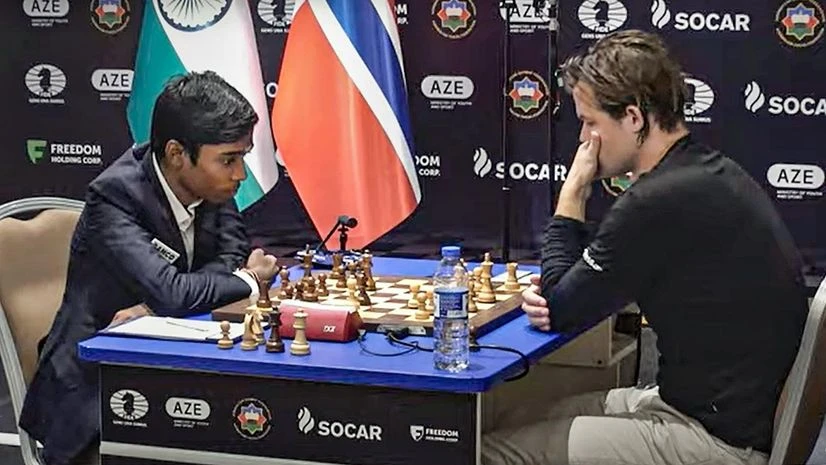 Indian Grandmaster R Praggnanandhaa and Norway's Grandmaster and World No. 1 player Magnus Carlsen during the second match of the Chess World Cup 2023 final, in Baku, Wednesday, Aug 23, 2023. (PTI Photo) Indian Grandmaster R Praggnanandhaa and Norway's Grandmaster and World No. 1 player Magnus Carlsen during the second match of the Chess World Cup 2023 final, in Baku, Wednesday, Aug 23, 2023. (PTI Photo)