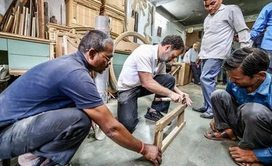 Rahul Gandhi meets carpenters at Delhi's Kirti Nagar furniture market Rahul Gandhi at furniture shop
