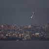 UNSC again delays vote on Gaza aid resolution amid talks to avoid US veto An Israeli army flare is seen over the Gaza Strip