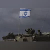 G20 leaders to mention regional 'conflicts' in tight draft statement Israeli soldiers manoeuver armored military vehicles along Israel's border with the Gaza Strip, in southern Israel