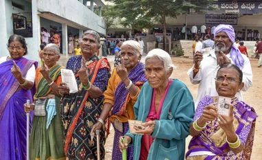 Hyderabad: Voters show their fingers marked with indelible ink after casting their votes for Telangana Assembly elections (PTI Photo) Hyderabad: Voters show their fingers marked with indelible ink after casting their votes for Telangana Assembly elections (PTI Photo)