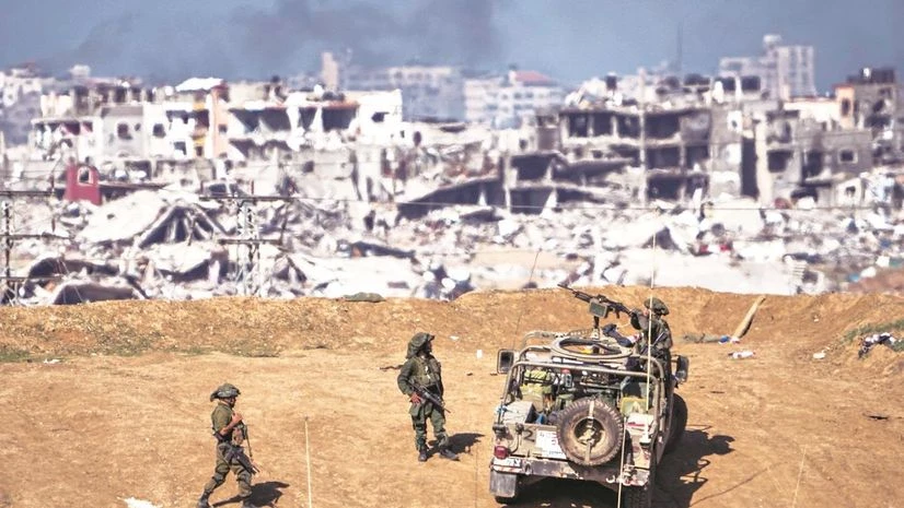 Israeli army troops near the Gaza Strip border on Sunday Israeli army troops near the Gaza Strip border on Sunday