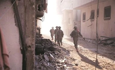 Israel pulling troops from Gaza in precursor to scaled-back offensive Israeli soldiers operate in the Gaza Strip amid intensifying air and ground offensive photo: reuters