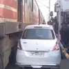 car avoiding collision with train