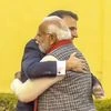 Prime Minister Narendra Modi hugs French President Emmanuel Macron at the Jantar Mantar, in Jaipur