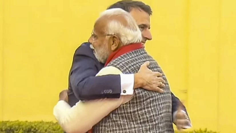 Prime Minister Narendra Modi hugs French President Emmanuel Macron at the Jantar Mantar, in Jaipur Prime Minister Narendra Modi hugs French President Emmanuel Macron at the Jantar Mantar, in Jaipur