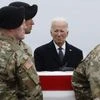 Joe Biden places his hand over his heart during a dignified transfer at Dover Air Force Base on Feb. 2.