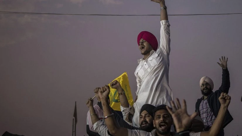 Indian farmers celebrate Prime Minister Narendra Modi scrapping farm laws following a year of persistent street protests, in Singhu, Delhi, in November 2021. Photographer: Anindito Mukherjee/Bloomberg Indian farmers celebrate Prime Minister Narendra Modi scrapping farm laws following a year of persistent street protests, in Singhu, Delhi, in November 2021. Photographer: Anindito Mukherjee/Bloomberg