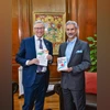 EAM S Jaishankar and Co-Founder of Microsoft Bill Gates exchange books during a meeting. (PTI Photo) EAM S Jaishankar and Co-Founder of Microsoft Bill Gates exchange books during a meeting. (PTI Photo)