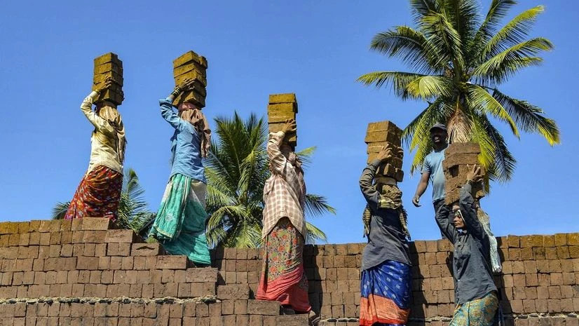 Karad: Women labourers work at a brick kiln ahead of International Women's Day, in Karad (PTI Photo) Karad: Women labourers work at a brick kiln ahead of International Women's Day, in Karad (PTI Photo)