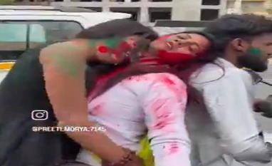 UP Police fines a man and two women Rs 33000 for playing Holi on scooter UP Police fines a man and two women Rs 33000