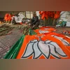 Workers arrange BJP flags ahead of the Lok Sabha elections, at the party office in Jammu, Tuesday, April 2, 2024. (PTI Photo) Workers arrange BJP flags ahead of the Lok Sabha elections, at the party office in Jammu, Tuesday, April 2, 2024. (PTI Photo)