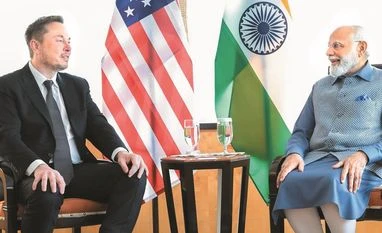 Elon Musk's Tesla initiates formal dialogue with govt on new EV policy Tesla chief Elon Musk (left) and Prime Minister Narendra Modi had previously met in June last year in New York | PHOTO: PTI FILE