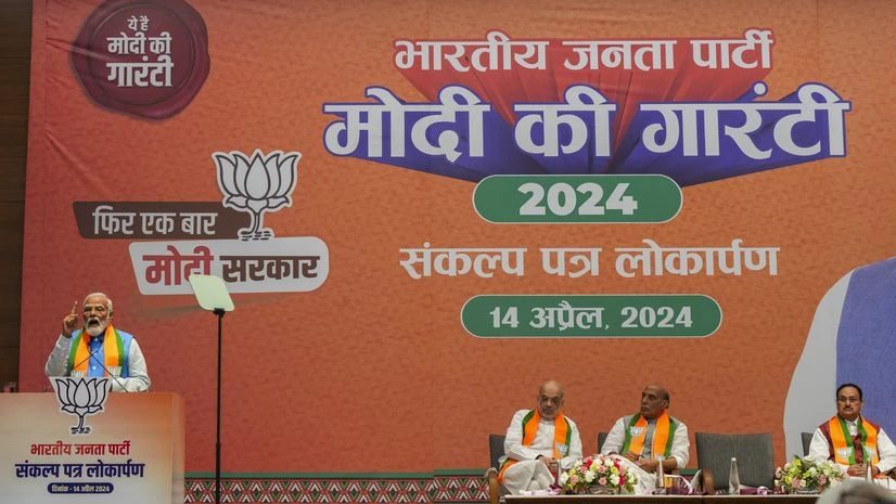 PM Narendra Modi addresses during the release of party's election manifesto ‘Sankalp Patra' for the Lok Sabha polls. Union Home Minister Amit Shah, Defence Minister Rajnath Singh and BJP National President JP Nadda are also seen (PTI Photo) PM Narendra Modi addresses during the release of party's election manifesto ‘Sankalp Patra’ for the Lok Sabha polls. Union Home Minister Amit Shah, Defence Minister Rajnath Singh and BJP National President JP Nadda are also seen (PTI Photo)