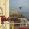 An official slides down a rope during a helicopter raid on MSC Aries ship at sea in this screen grab obtained from a social media video released on April 13, 2024. Video obtained by Reuters/via REUTERS An official slides down a rope during a helicopter raid on MSC Aries ship at sea in this screen grab obtained from a social media video released on April 13, 2024. Video obtained by Reuters/via REUTERS