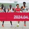 Chinese runner He Jie, Ethiopian Dejene Hailu Bikila and Kenyans Robert Keter and Willy Mnangat take part in a half-marathon in Beijing, China April 14, 2024