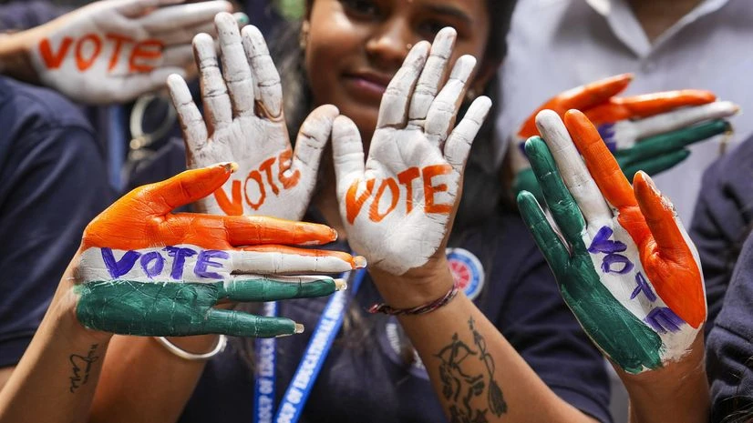 Bengaluru: Students with their hands painted urging to vote for ongoing Lok Sabha polls take part in a voter awareness campaign, in Bengaluru, Saturday, April 20, 2024. (PTI Photo/Shailendra Bhojak) Bengaluru: Students with their hands painted urging to vote for ongoing Lok Sabha polls take part in a voter awareness campaign, in Bengaluru, Saturday, April 20, 2024. (PTI Photo/Shailendra Bhojak)