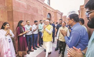 PMO staffers welcome Prime Minister Narendra Modi on Monday | Photo: PTI PMO staffers welcome Prime Minister Narendra Modi on Monday | Photo: PTI
