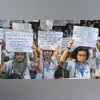 Junior doctors under banner of Trinamool Congress Medical Cell participate in a protest against alleged irregularities in NEET-UG 2024 results, in Kolkata, June. 11, 2024. (PTI) NEET UG 2024