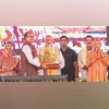 Will continue serving developed India's 4 pillars, says PM Narendra Modi Prime Minister Narendra Modi flanked by Union Agriculture Minister Shivraj Singh Chouhan (left) and CM Yogi Adityanath at the Kisan Samman Sammelan, in Varanasi on Tuesday. (Photo: PTI)