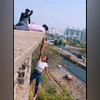 Pune girl hangs from a tall building for grip test Pune girl hangs from a tall building for grip test