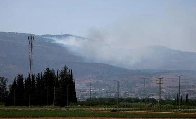 Israel's presence in occupied Palestinian territories is illegal: UN court FILE PHOTO: Smoke rises, amid ongoing cross-border hostilities between Hezbollah and Israeli forces, in Kiryat Shmona, northern Israel, June 14, 2024. REUTERS