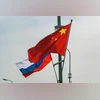 China hits out at Nato for branding it as 'decisive enabler' of Ukraine war The flags of Russia and China