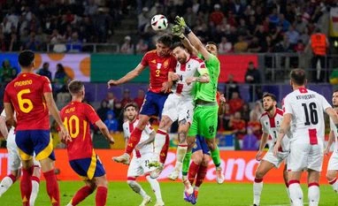 Georgia's goalkeeper Giorgi Mamardashvili, center right, reaches for a ball during a round of sixteen match between Spain and Georgia at the Euro 2024 soccer tournament in Cologne, Germany Georgia's goalkeeper Giorgi Mamardashvili, center right, reaches for a ball during a round of sixteen match between Spain and Georgia at the Euro 2024 soccer tournament in Cologne, Germany