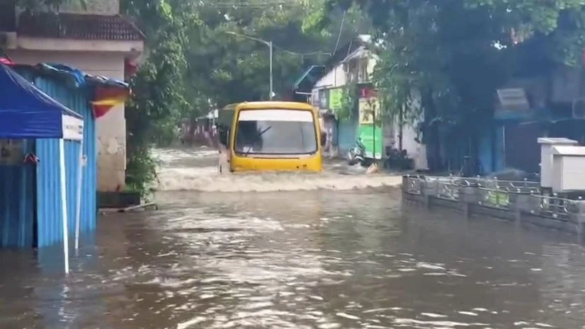 Mumbai rains A bus moves on a flooded road following heavy rainfall, near Andheri Subway in Mumbai. (Photo: PTI)