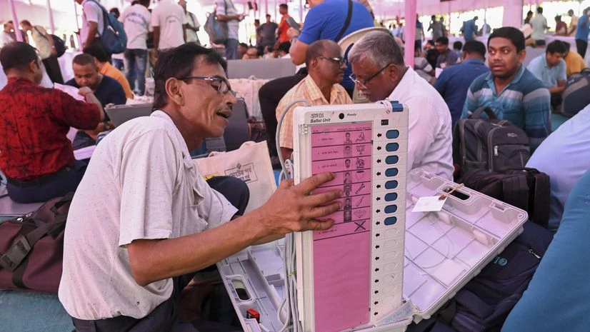 Polling official, EVM, election Polling official, EVM, election