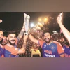 Virat Kohli and Rohit Sharma with the T20 World Cup trophy during the bus ride in Mumbai. File Photo: BCCI