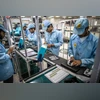 Industry body warns China's curbs threaten India's smartphone exports Mobile phones, smartphones, Factory workers, workshop, employment, jobs, unemployment
