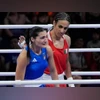 Olympics 2024: Algerians rally behind gold as Khelif advances to final | Olympic Games News Algeria's Khelif (Red) and Italy's Carini (Blue) after thier match at 2024 Paris Olympics (Pic: X/@jk_rowling)