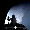 Tech billionaire Jared Isaacman outside the Dragon capsule