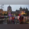 Mumbai: Pedestrians cross a road amid rain, in Mumbai, Wednesday, Sept. 25, 2024. (PTI Photo)