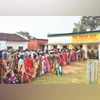 People wait to cast their votes for the first phase of Assembly polls in West Singhbhum district, Jharkhand, on Wednesday. (Photo: PTI) People wait to cast their votes for the first phase of Assembly polls in West Singhbhum district, Jharkhand, on Wednesday. (Photo: PTI)