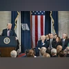 Former President Bill Clinton, from right, former Vice President Kamala Harris, her husband Doug Emhoff and former President Joe Biden listen and President Donald Trump Former President Bill Clinton, from right, former Vice President Kamala Harris, her husband Doug Emhoff and former President Joe Biden listen and President Donald Trump
