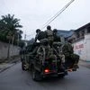 Members of the M23 rebel group ride on a pickup truck as they leave their position for patrols amid conflict between them and FARDC, in Goma, eastern Democratic Republic of the Congo, January 29, 2025 | Photo by Stringer on Reuters