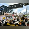 Protesters rebelling against Musk's purge of US govt swarm Tesla showrooms Tesla protests