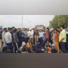 People during a protest by residents of Ghazipur on Akshardham-Ghaziabad road against the alleged murder of a young man, in Delhi,
